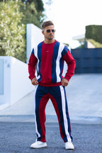 Nextage Men wearing stylish crew neck  red, white, and blue striped tracksuit with sunglasses outdoors.