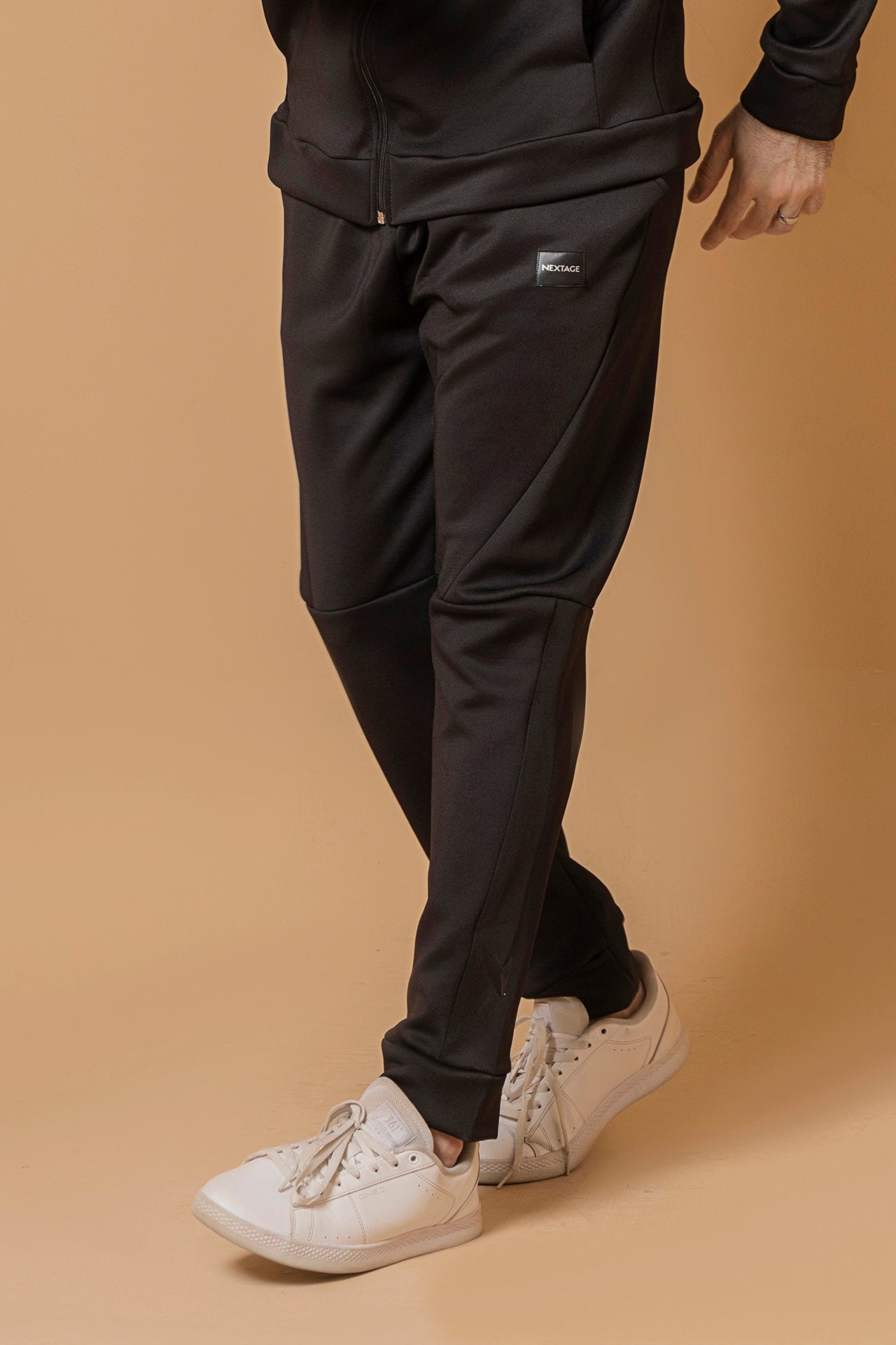 Trouser view of men’s black winter tracksuit by Nextage, casual slim fit sportswear