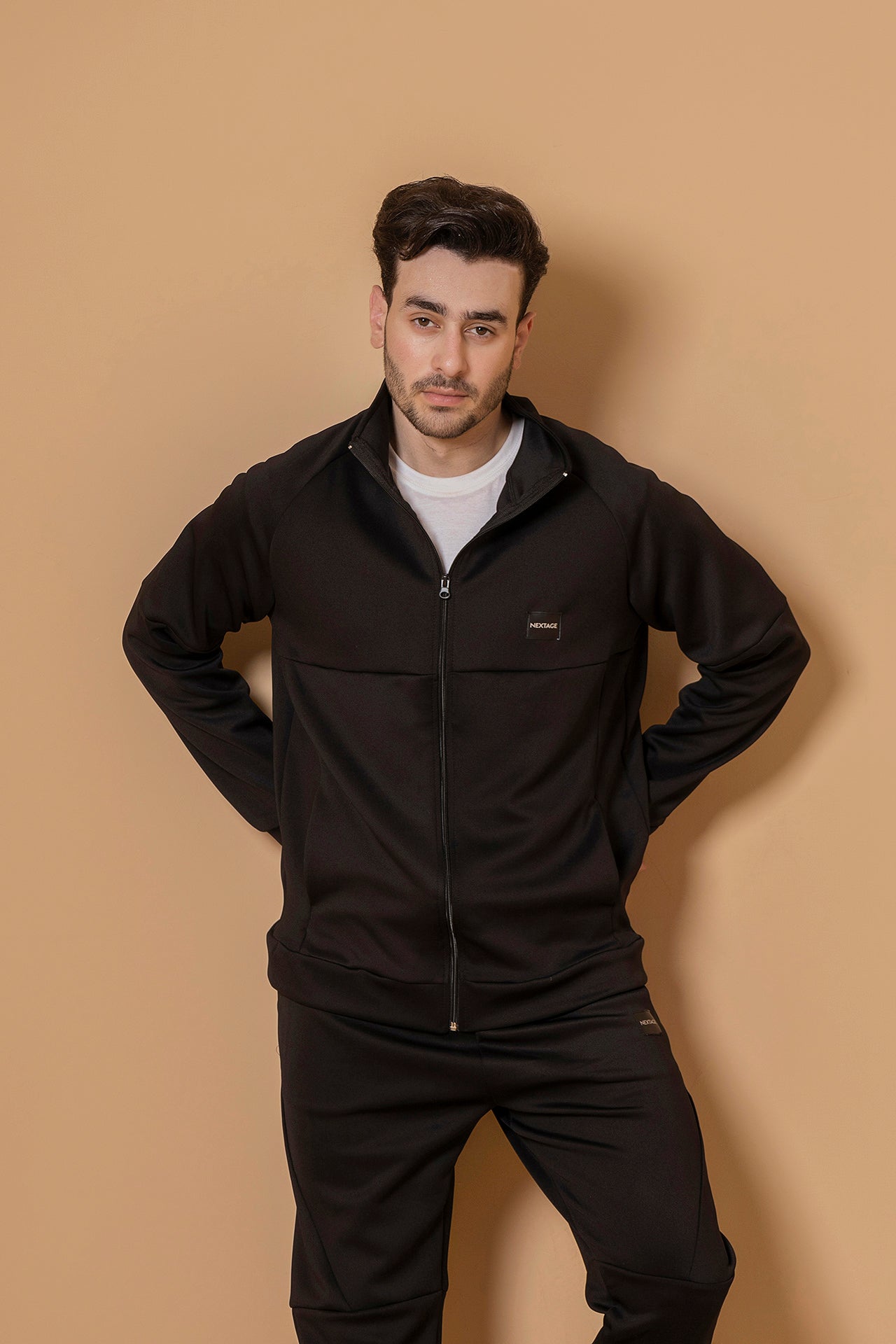 Closeup of Nextage men’s black tracksuit jacket, zip-up winter outfit for men