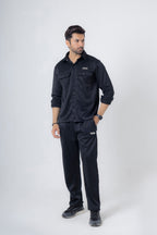 Man wearing Nextage black safari fleece tracksuit, full-body front view in breathable warm polyester fleece