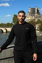 Stylish black winter tracksuit with metal slogan design