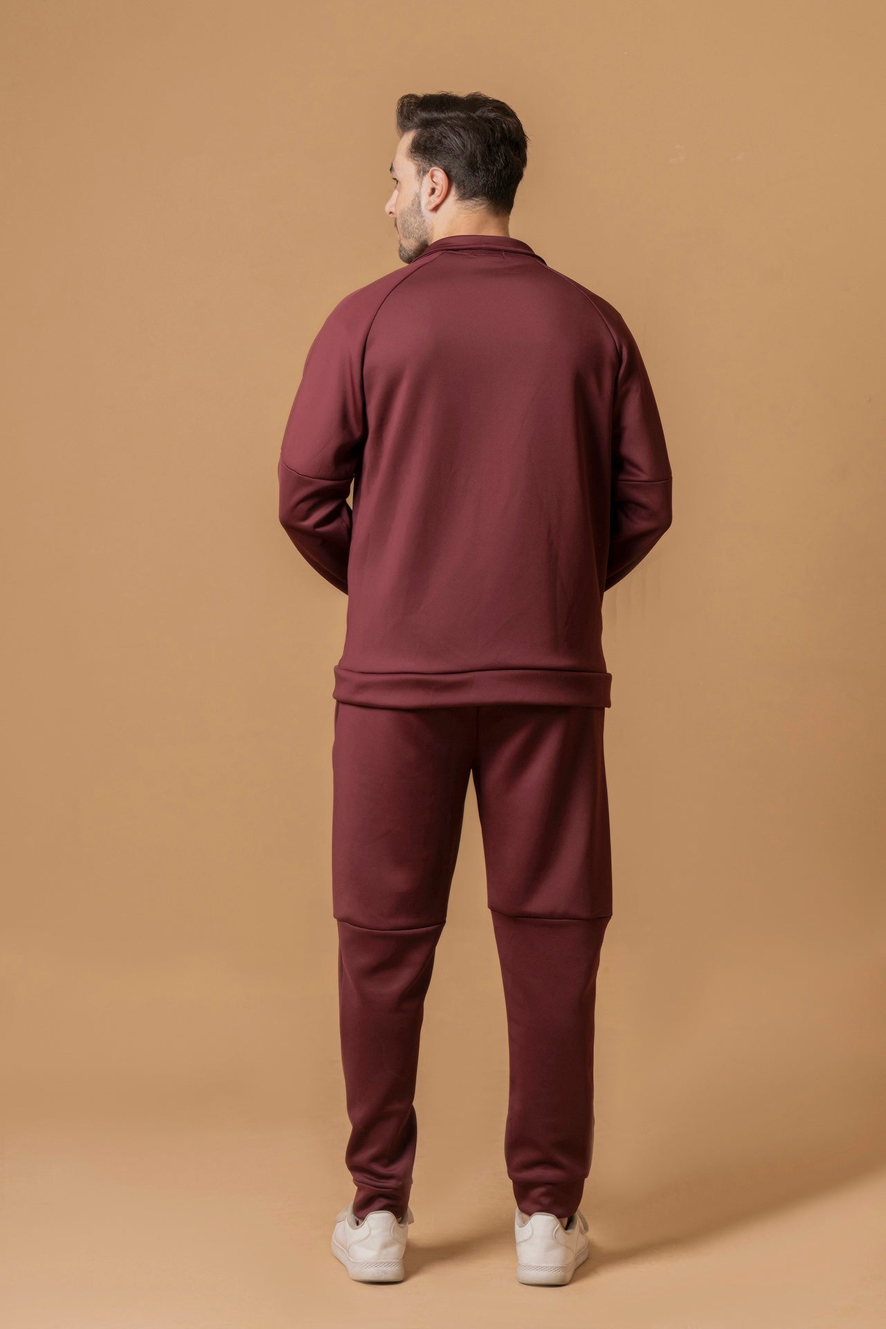 Back view of men’s burgundy winter tracksuit by Nextage, casual sportswear set