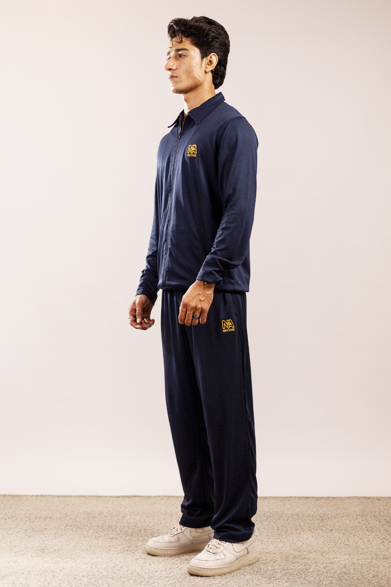 Side View of Nextage Navy Tracksuit with Zip Detail