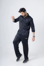 Side profile of man wearing Nextage black safari fleece tracksuit showing modern fit and design