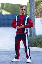 Nextage Model wearing a Burgundy, white, and Navy tracksuit with sunglasses outdoors.