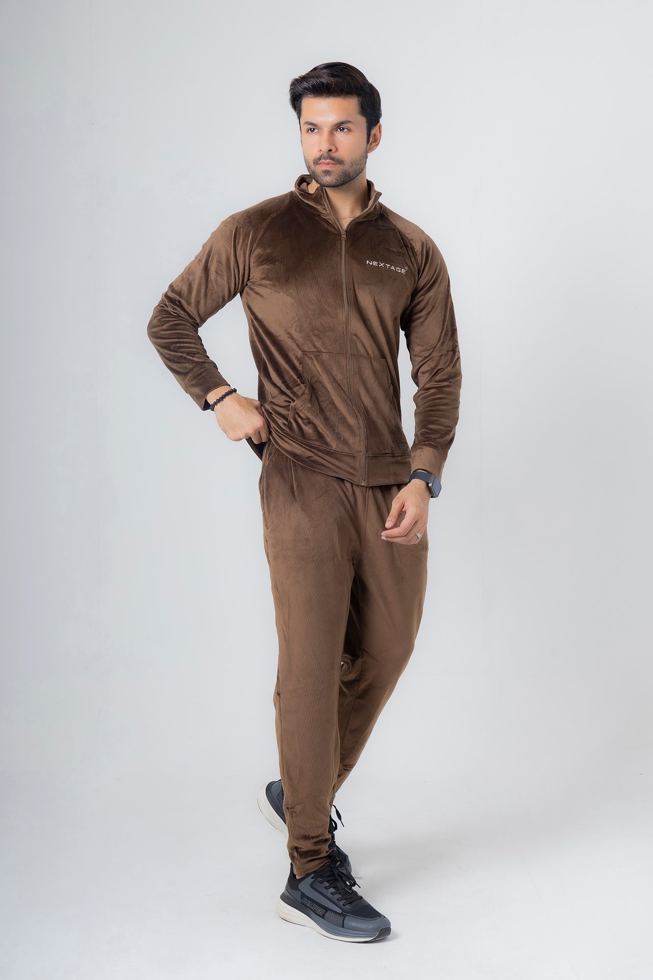 nextage model wearing a luxury look velour tracksuit